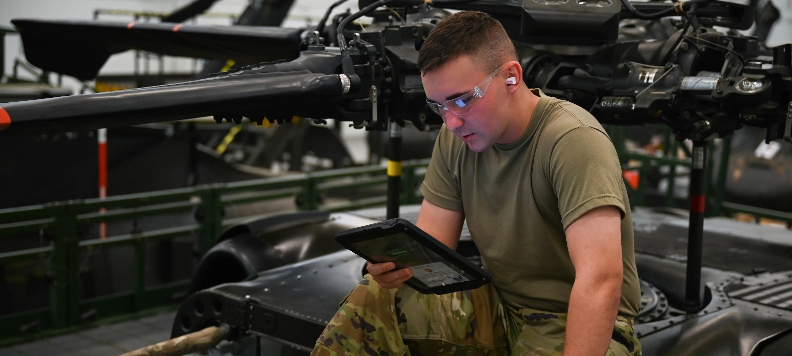 A soldier looking at a tablet