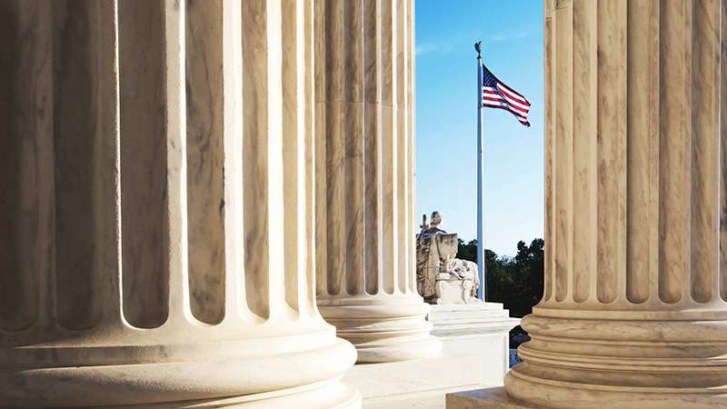 A view of the U.S. Supreme Court building, showcasing its neoclassical architecture and prominent steps.