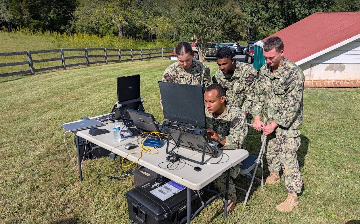 Midshipmen engage in hands-on training with CACI’s electronic warfare and counter-UAS (c-UAS) systems.