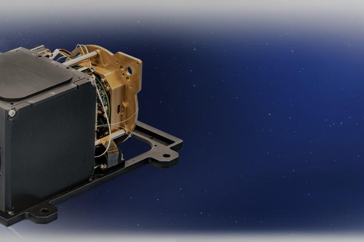 A satellite equipped with a camera positioned on its top, capturing images from space.