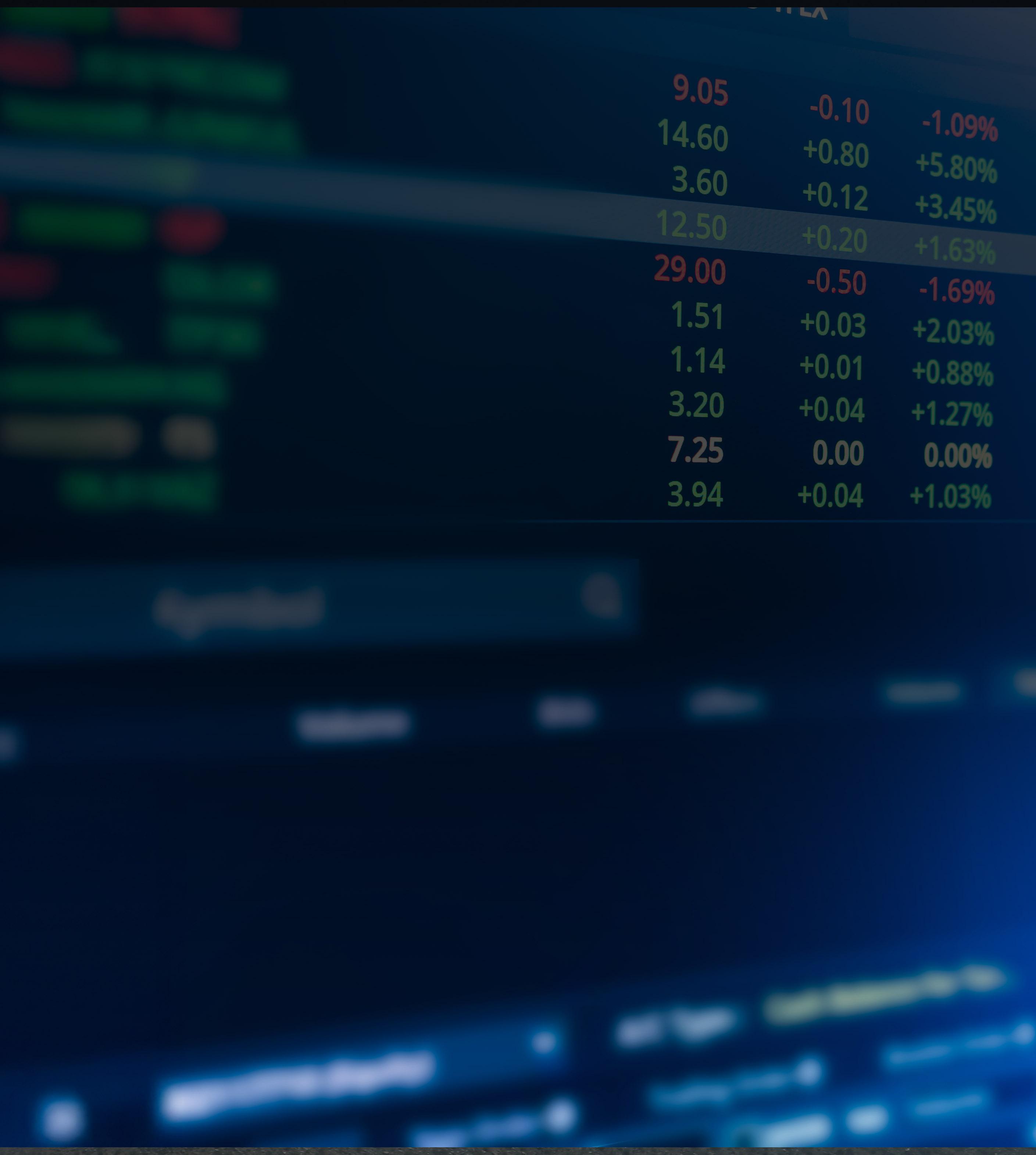 Close-up of a computer screen displaying stock market data with graphs and numerical values.