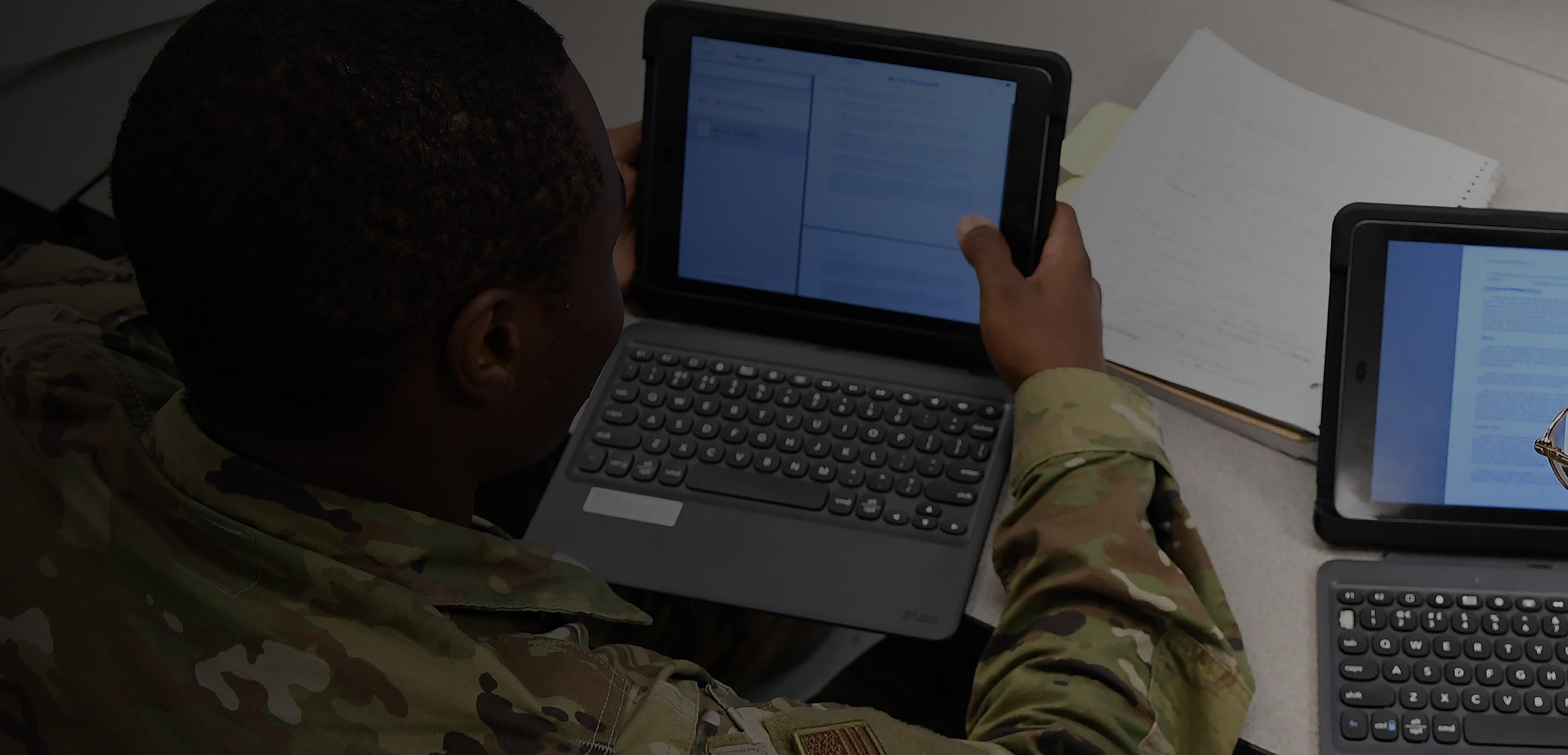 Soldier looking at tablet screen