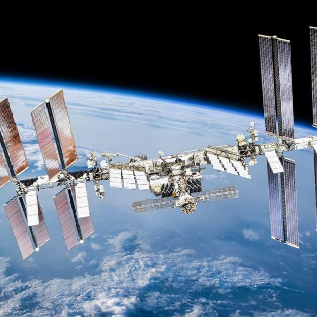 The International Space Station orbits Earth, showcasing its intricate structure against the backdrop of space.