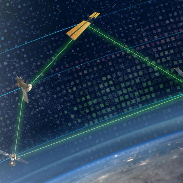 Satellites in orbit are being precisely controlled by lasers, showcasing advanced technology in space management.