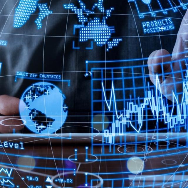 Businessman analyzing global business graph on a tablet, showcasing data trends and insights for strategic decision-making.