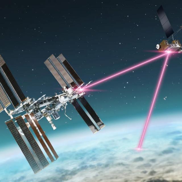 An artists rendition of a satellite floating above the earth