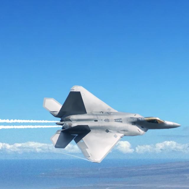 A fighter jet soaring through the sky, trailing smoke from its tail as it performs an aerial maneuver.