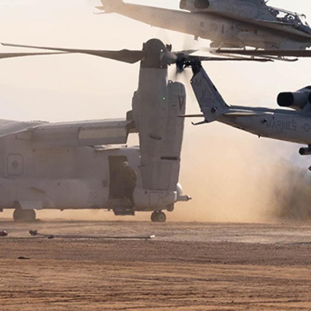 A group of soldiers loading into a helicopter