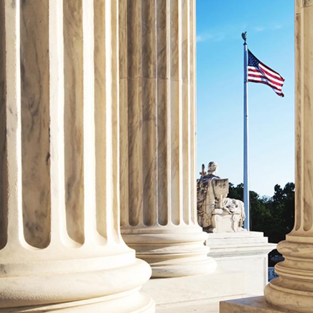 A view of the U.S. Supreme Court building, showcasing its neoclassical architecture and prominent steps.