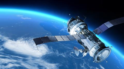 Orbiting satellite with Earth's blue and green continents visible in the background.