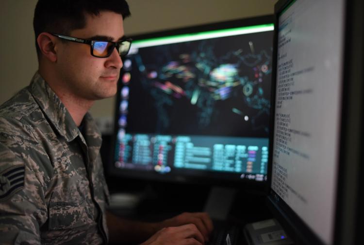 A soldier looking at a computer screen